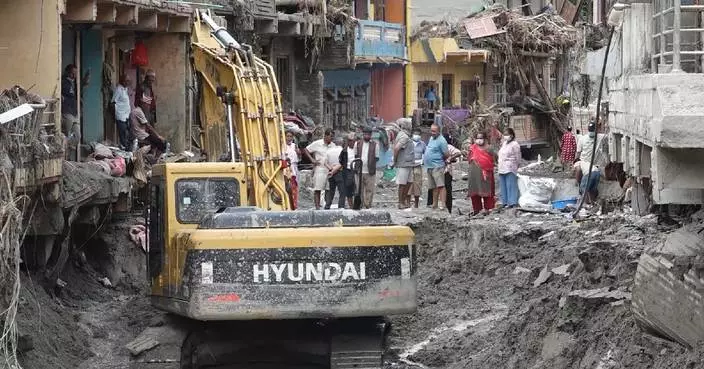 Grim search continues in Nepal as mudslide survivors scour ruined homes for essentials