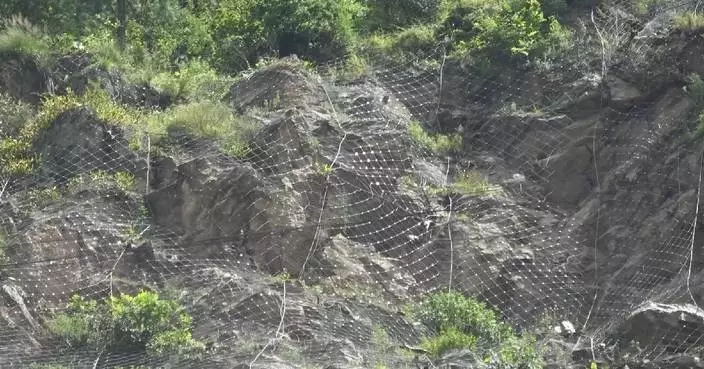 Rescuers take measures to secure safe road access to mudslide-hit Gyirong Port