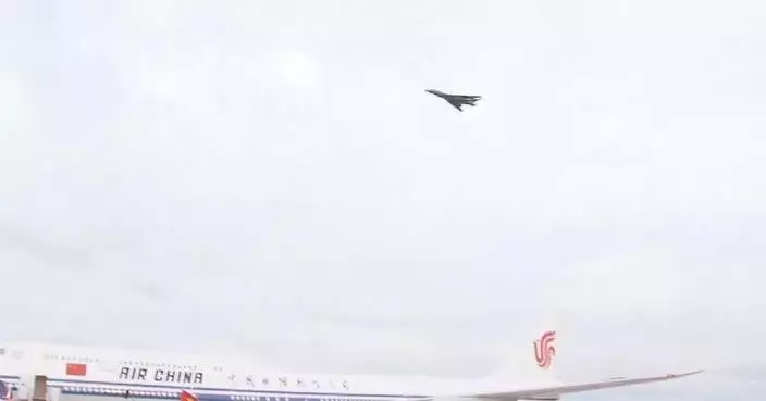 Trump greets Xi with military flyover at airport