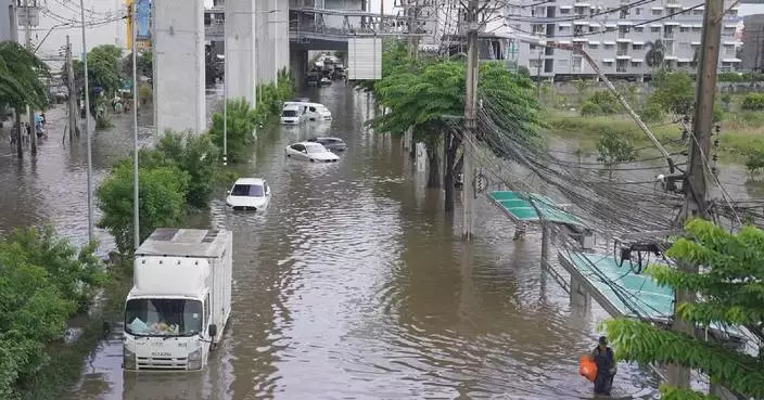 Bangkok races to drain floodwater as rain subsides, swollen canals hamper relief efforts