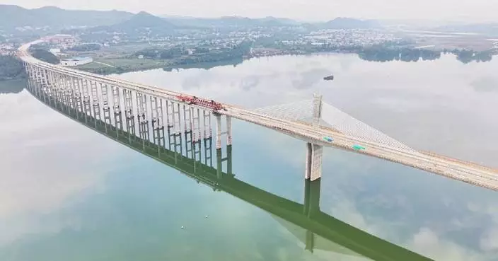 Sections of major expressway bridge fully joined in southwest China's Sichuan