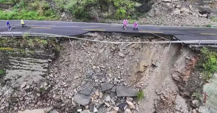 Heavy rain triggers road collapse in southwest China's Chongqing