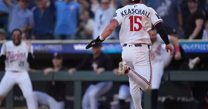 Twins top Yankees 5-4 in 13 innings on Caratini's single after Judge leaves early with leg tightness