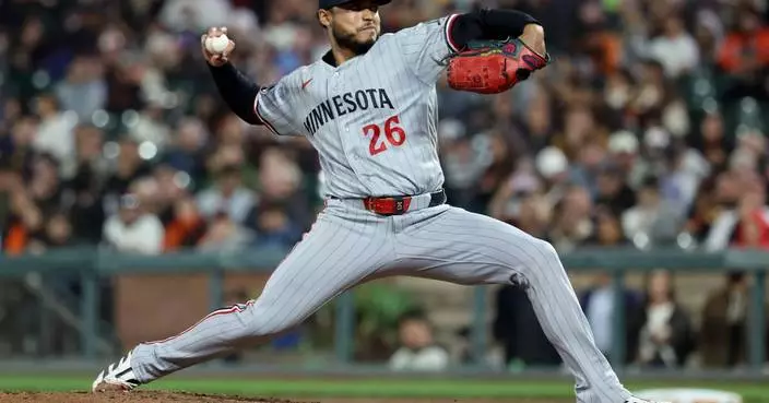 Bradley passes 200 strikeouts, pitches Twins to 3-2 win over Giants