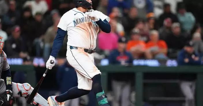 Mariners rally past Astros 6-5 in 10 innings to keep faint playoff hopes alive