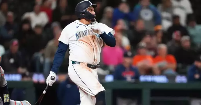 Mariners rally past Astros 6-5 in 10 innings to keep faint playoff hopes alive