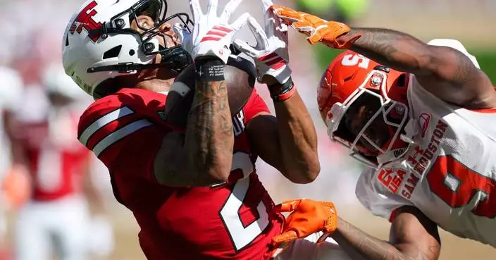 Romaine has 2 quick pick-6s as No. 11 Texas Tech beats Sam Houston 49-14 for 11th home win in row