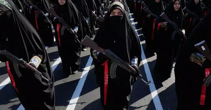 Iran stages massive Tehran rally as volunteers pledge to take up arms, in photos