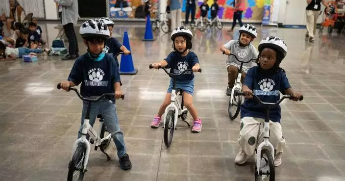 A childhood rite moves indoors as kindergartners learn to ride bikes in school gyms