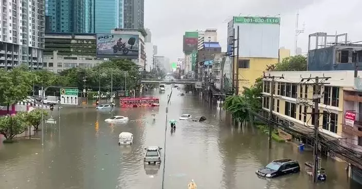 Heavy rain and flooding in Bangkok disrupts traffic and prompts evacuations