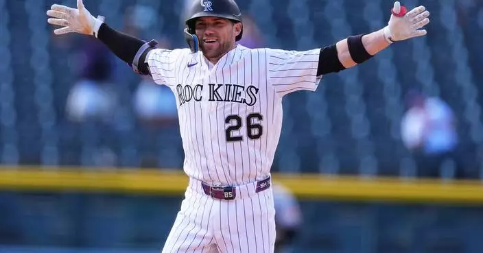 Brett Sullivan's 2-run single in the 11th lifts the Rockies to a 6-5 win over the Orioles