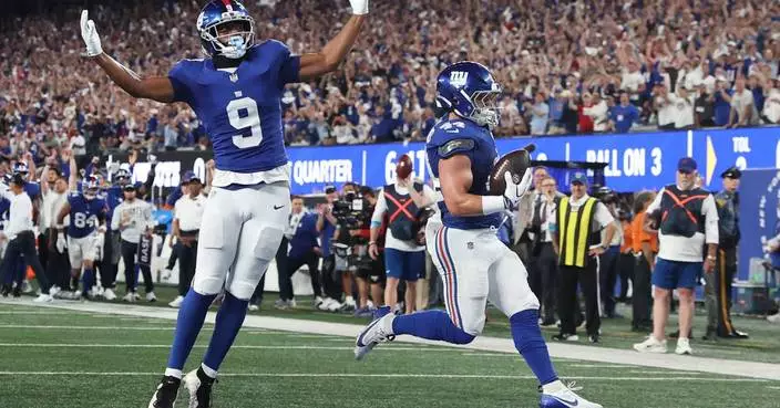Giants' offense rolls over the Cowboys to give coach John Harbaugh a 28-20 win in his debut