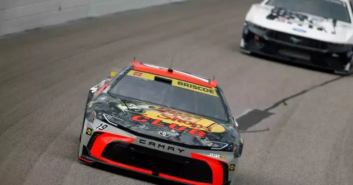 Kyle Larson passes Chase Briscoe with 7 laps left to win for the fourth time at Kansas Speedway
