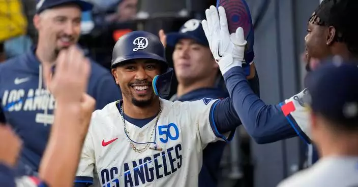 Dodgers outslug Giants 10-4, led by Mookie Betts with four hits