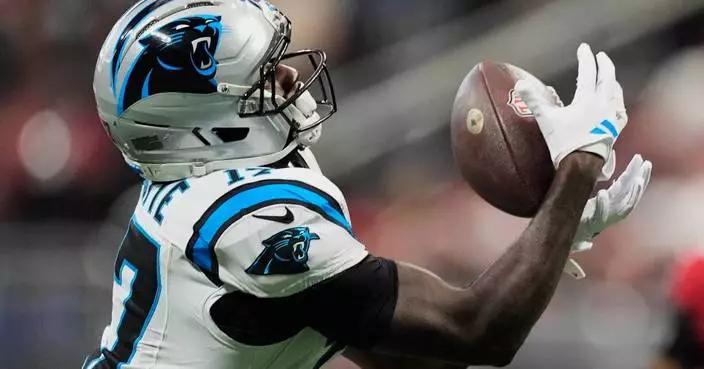 Young throws 3 TD passes, including 2 to Waller, as Panthers dominate short-handed Falcons 34-3