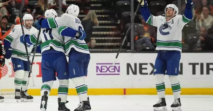 Hronek’s OT power-play goal caps the Canucks’ 6-5 comeback win over the Ducks