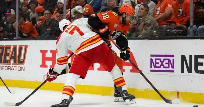 Pospisil's tiebreaking third-period goal pushes Flames to first win of the season, 4-2 over Ducks