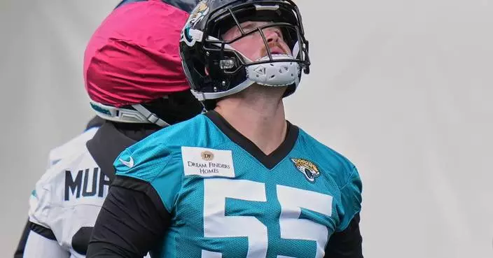 Long snapper cuts short camping trip and locates passport to sign with Jaguars in London