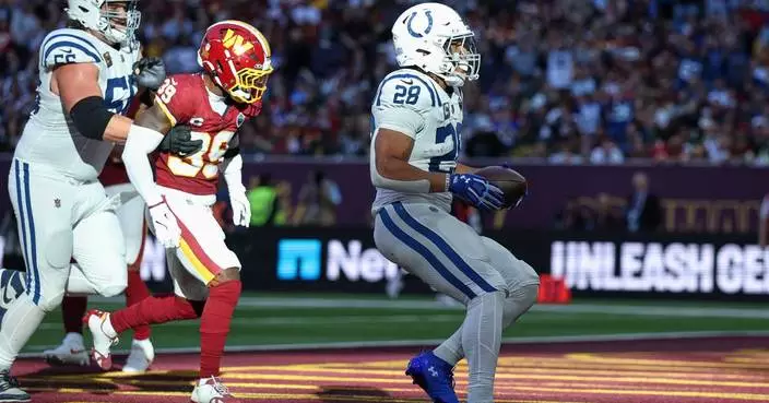 Taylor runs for 2 TDs and Colts beat Commanders 30-13 in London