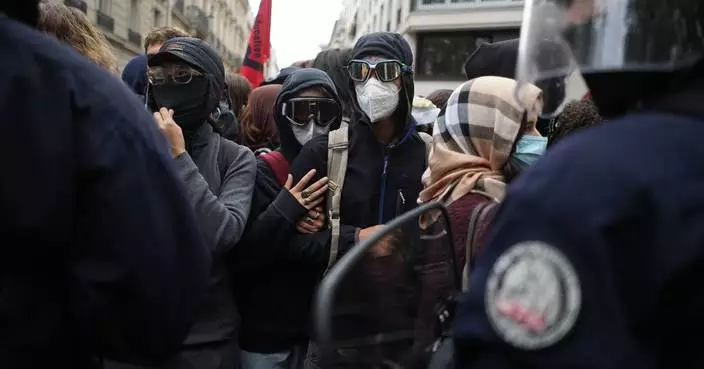 Police fire tear gas at a barricaded high school in Paris as school protests show no sign of ending