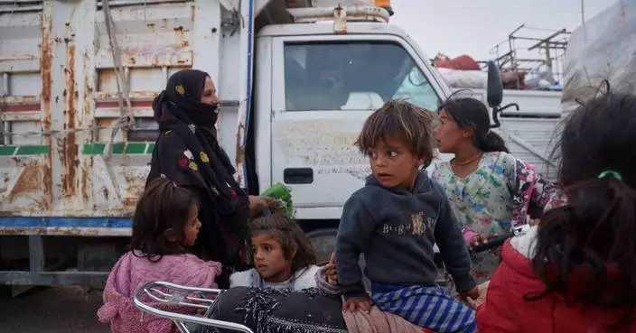 Photos show displaced Syrian families returning to damaged homes after seven years