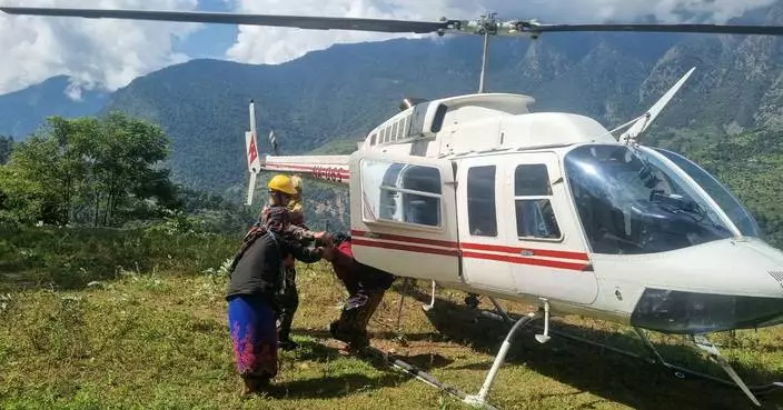 Rescue helicopters race to flood-hit Nepal villages as 5 reported missing