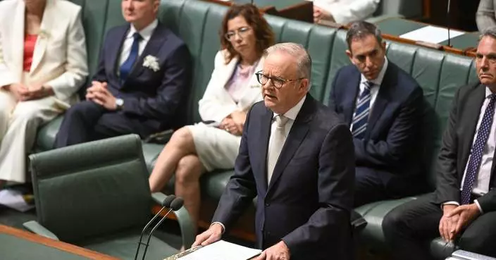 Australian Parliament pays tribute to injured lawmaker as it resumes work under increased security