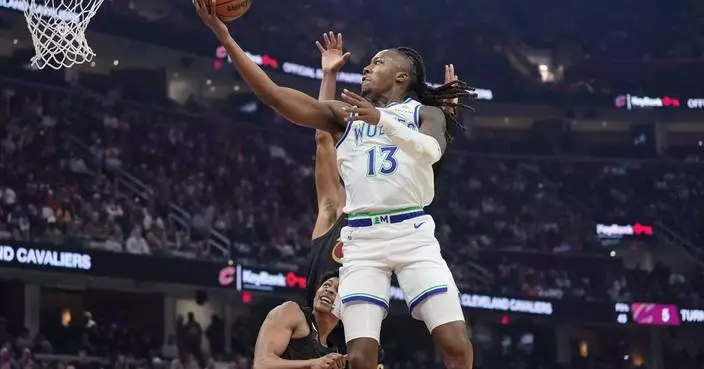 Mitchell scores 26 as Cavaliers rally and defeat Timberwolves 127-125 in overtime