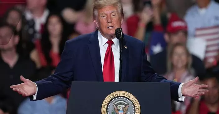 The Latest: Trump interrupted by protesters as he campaigns for Paxton in US Senate race in Texas