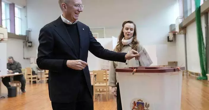 Latvians vote for a new parliament as fears of Russian hybrid attacks loom