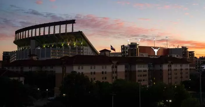 Texas bans a fan who made obscene gesture at Florida players