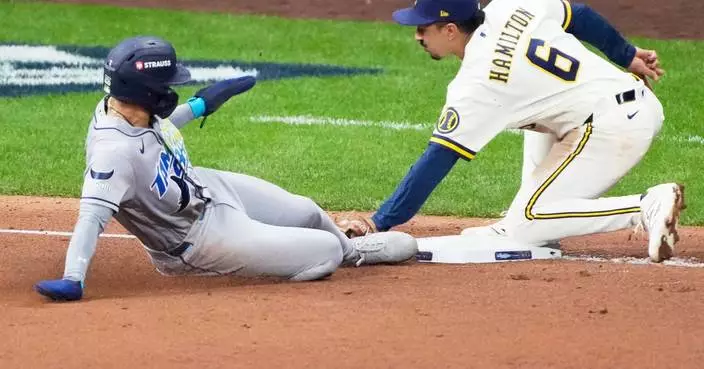 Balls glancing off gloves, runners thrown out trying to steal sink Rays in World Series opener