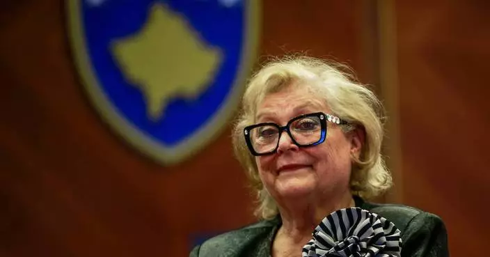 Kosovo lawmakers elect a new president in a late-night vote to avert snap election