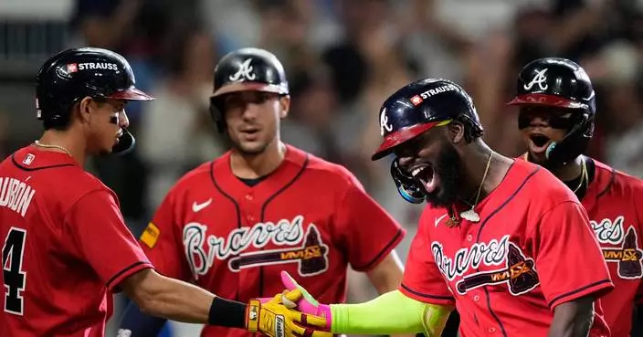 Braves hit 3 homers, including 3-run shot by Harris, to beat Phillies 6-2 in wild card clincher
