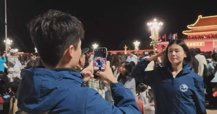 Young people wait overnight for China's symbolic National Day flag-raising ceremony