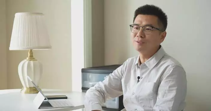 Named after National Day, finance professional's career mirrors China's industry growth