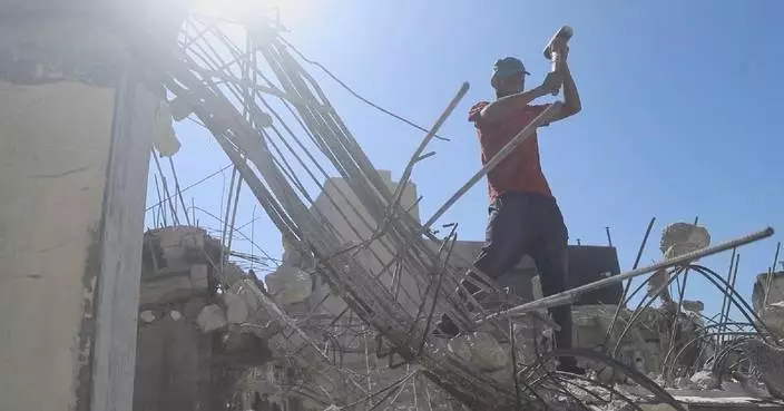 Palestinians recover waste steel from building ruins to make a living, reinforce shelters
