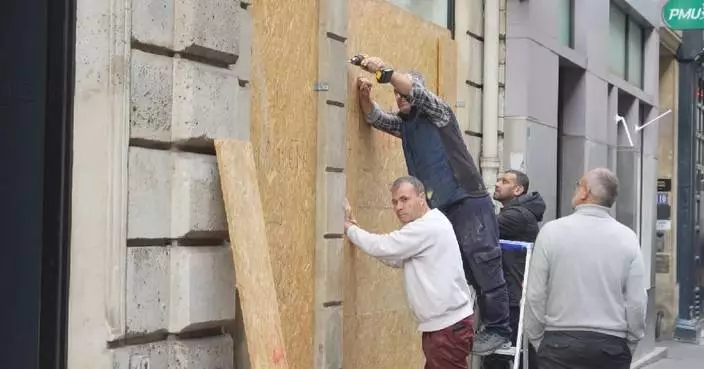 Paris shop owners board up storefronts as new protests expected