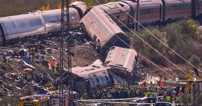 Photos show aftermath of deadly high-speed train collision in Spain