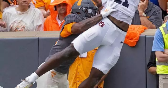 Bishop rushes for 220 yards, 3 TDs to lead No. 17 Tennessee over Auburn 24-14