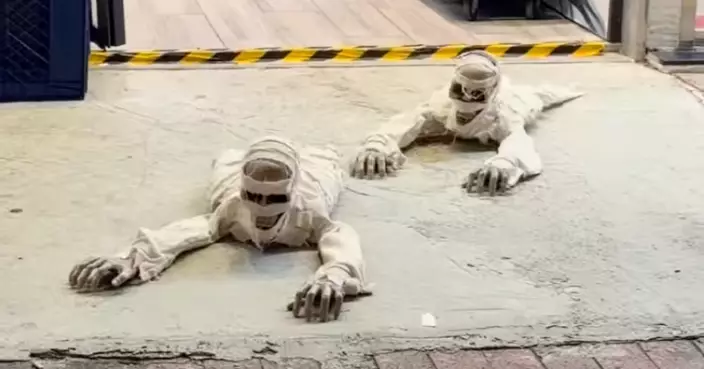 Halloween Approaches with Spooky Shop Decorations: “Living Mummies” Crawl Along Quarry Bay Street