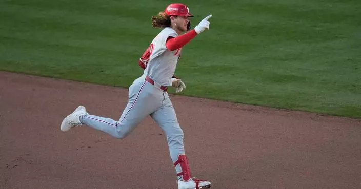 Harper atones for outfield gaffe, Bohm homers in 10th as Phillies beat Braves 4-3 to force Game 3