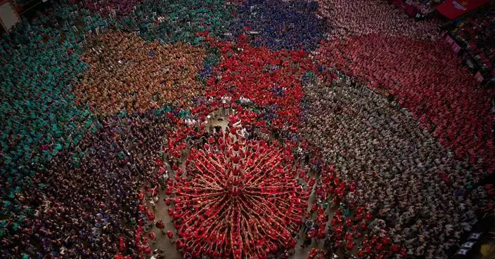 Photos show colorful teams building human towers in Spain’s Catalonia