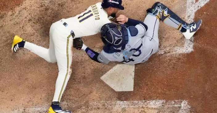 Photos of the Brewers and Rays battling for their first World Series title
