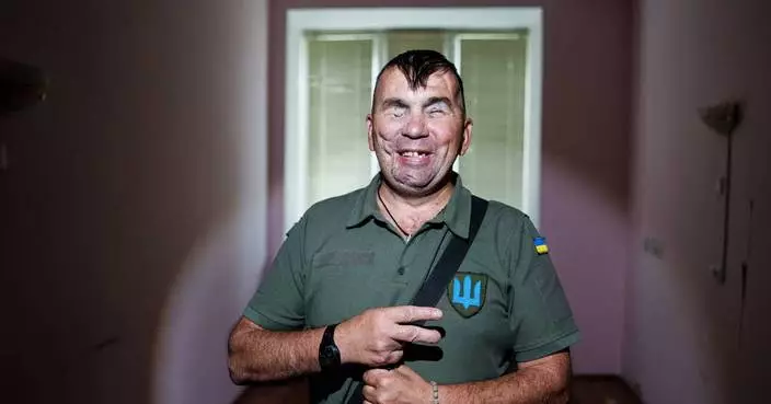 A Ukrainian soldier blinded in war hopes to see his children again, in photos