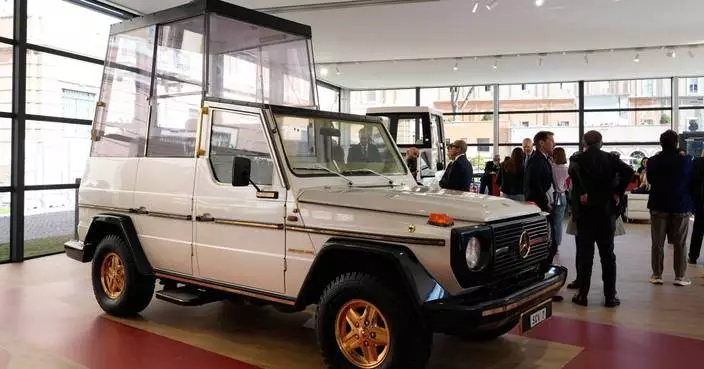 A popemobile exhibition at the Vatican features the vehicle popes have used since 1930
