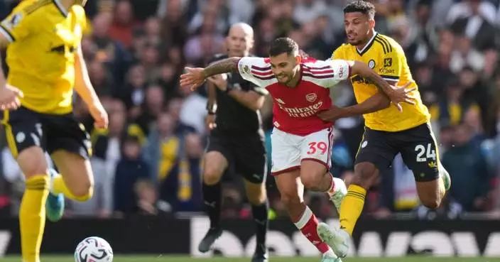 Arsenal roars back to beat Leeds 2-1 as Calafiori and Guimarães net Emirates firsts