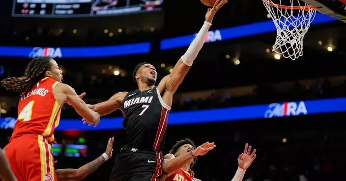 Giannis Antetokounmpo has 24 points, 18 rebounds as the Heat beat the Hawks 129-117 for first win
