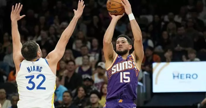 Booker scores 43 points in Suns' 131-122 win over Warriors, who fall to 0-3