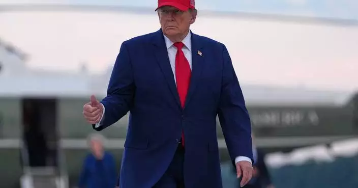 Trump puts new Russia sanctions passed by Congress on hold, saying waiver is in US national interest